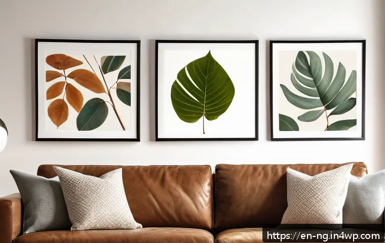 가정에서 자연을 주제로 한 미술 프로젝트 - A cozy living room scene featuring vibrant leaf prints on white paper framed and hung on a neutral w...